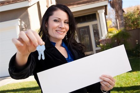 simsearch:400-04207596,k - Happy Attractive Hispanic Woman Holding Blank Sign and Keys in Front of House. Stock Photo - Budget Royalty-Free & Subscription, Code: 400-05193537