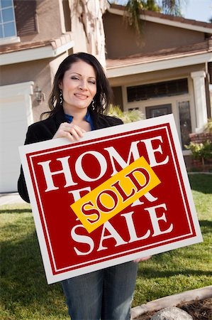 simsearch:693-03308239,k - Happy Attractive Hispanic Woman Holding Red Sold Home For Sale Sign In Front of House. Stock Photo - Budget Royalty-Free & Subscription, Code: 400-05193544