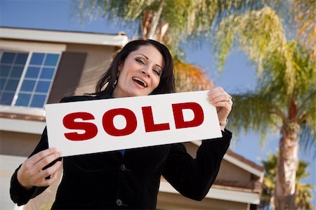 simsearch:693-03308239,k - Happy Attractive Hispanic Woman Holding Sold Sign In Front of House. Stock Photo - Budget Royalty-Free & Subscription, Code: 400-05193540