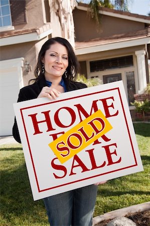 simsearch:693-03308239,k - Happy Attractive Hispanic Woman Holding Sold Home For Sale Sign In Front of House. Stock Photo - Budget Royalty-Free & Subscription, Code: 400-05193552
