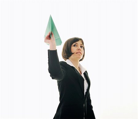 happy young business woman isolated ona white throwing paper airplane Photographie de stock - Aubaine LD & Abonnement, Code: 400-05204431