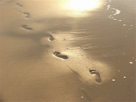 Foot prints going over a sand close to sea. Stock Photo - Budget Royalty-Free & Subscription, Code: 400-05205512