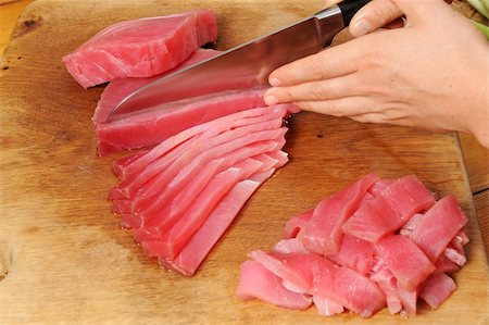 edible picture of fish - tuna fish being sliced and chopped Stock Photo - Budget Royalty-Free & Subscription, Code: 400-05205605