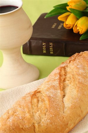 Chalice with red wine, bread, Holy Bible and tulips Stock Photo - Budget Royalty-Free & Subscription, Code: 400-05206705