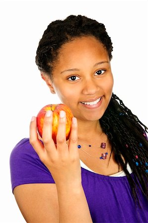 Isolated portrait of black teenage girl holding apple Stock Photo - Budget Royalty-Free & Subscription, Code: 400-05206774