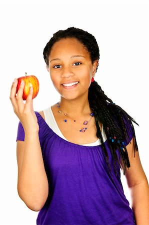 Isolated portrait of black teenage girl holding apple Stock Photo - Budget Royalty-Free & Subscription, Code: 400-05206775