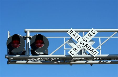 red signal of dangerous - A Railroad crossing sign Stock Photo - Budget Royalty-Free & Subscription, Code: 400-05206794