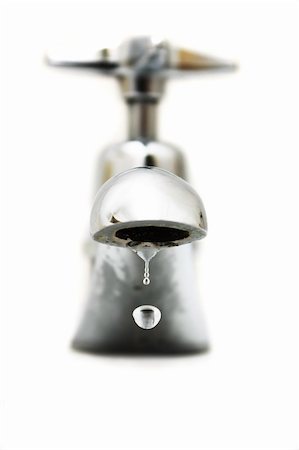 Closeup of water dropping from silver faucet. Stock Photo - Budget Royalty-Free & Subscription, Code: 400-05207445