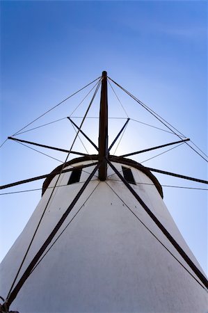 simsearch:400-05319608,k - A close up look at a windmill. Looking directly up at it with blue skies behind it. Stock Photo - Budget Royalty-Free & Subscription, Code: 400-05209567
