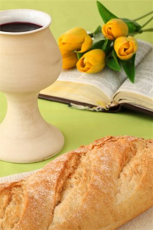 Chalice with red wine, bread, Holy Bible and tulips Stock Photo - Budget Royalty-Free & Subscription, Code: 400-05209583