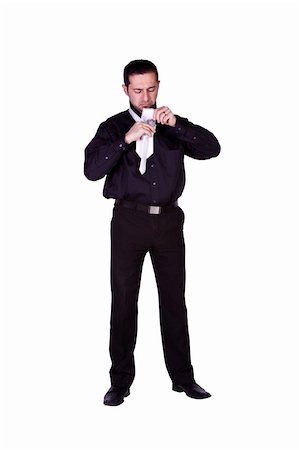 Businessman Putting His Tie On Getting Ready - Isolated Background Stock Photo - Budget Royalty-Free & Subscription, Code: 400-05200015