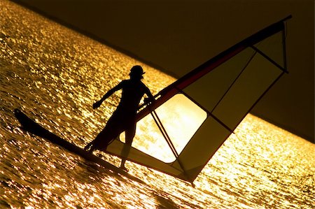 simsearch:400-03992760,k - Silhouettes of windsurfer at the evening glow Stock Photo - Budget Royalty-Free & Subscription, Code: 400-05201885