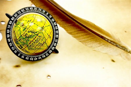 Antique globe and feather on grunge background Stock Photo - Budget Royalty-Free & Subscription, Code: 400-05202304