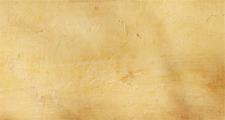 Grunge background - texture stucco of ochre color Foto de stock - Super Valor sin royalties y Suscripción, Código: 400-05203496