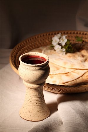 Chalice with red wine and pita bread in a basket Stock Photo - Budget Royalty-Free & Subscription, Code: 400-05216832