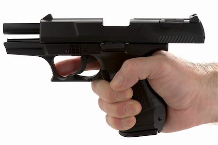 simsearch:400-04335613,k - Black pistol, or handgun, held in a male adult's hand, with the slide locked back after emptying the clip. Empty magazine. Stock Photo - Budget Royalty-Free & Subscription, Code: 400-05216841