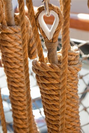 simsearch:400-05124606,k - Natural fibre ropes, rigging and block and tackle on a wooden sailing ship. Stock Photo - Budget Royalty-Free & Subscription, Code: 400-05216857