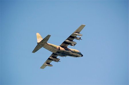 simsearch:400-04996557,k - A military plane flying, used normaly as a transport Stock Photo - Budget Royalty-Free & Subscription, Code: 400-05217858