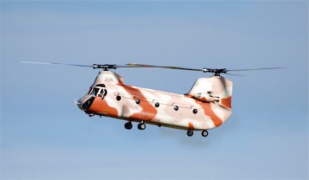 Radio Conltroled Chinook Helicopter against a blue sky Stock Photo - Budget Royalty-Free & Subscription, Code: 400-05218597