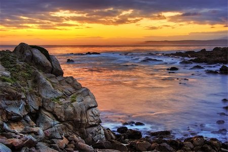 sur - A beautiful sunrise is seen over the Monterey harbor with waves crashing in the foreground Stock Photo - Budget Royalty-Free & Subscription, Code: 400-05224572