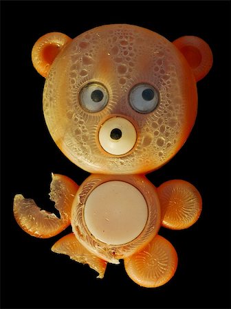 simsearch:400-05224637,k - Old chewed toy - a plastic bear on a black background Stock Photo - Budget Royalty-Free & Subscription, Code: 400-05224638