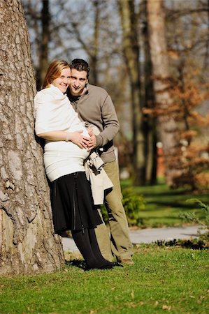 simsearch:400-04659391,k - happy young married family couple outdoor in nature have fun and waiting baby and representing young family growth and pregnancy concept Stock Photo - Budget Royalty-Free & Subscription, Code: 400-05225137