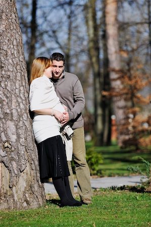 simsearch:400-04659391,k - happy young married family couple outdoor in nature have fun and waiting baby and representing young family growth and pregnancy concept Stock Photo - Budget Royalty-Free & Subscription, Code: 400-05225139