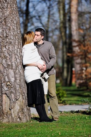 simsearch:400-04659391,k - happy young married family couple outdoor in nature have fun and waiting baby and representing young family growth and pregnancy concept Stock Photo - Budget Royalty-Free & Subscription, Code: 400-05225144