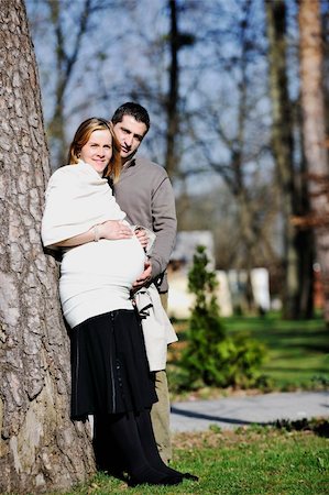 simsearch:400-04659391,k - happy young married family couple outdoor in nature have fun and waiting baby and representing young family growth and pregnancy concept Stock Photo - Budget Royalty-Free & Subscription, Code: 400-05225146
