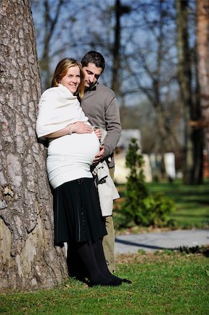 simsearch:400-04659391,k - happy young married family couple outdoor in nature have fun and waiting baby and representing young family growth and pregnancy concept Stock Photo - Budget Royalty-Free & Subscription, Code: 400-05225148