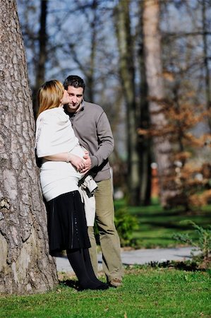 simsearch:400-04659391,k - happy young married family couple outdoor in nature have fun and waiting baby and representing young family growth and pregnancy concept Stock Photo - Budget Royalty-Free & Subscription, Code: 400-05225141