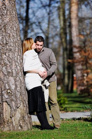 simsearch:400-04659391,k - happy young married family couple outdoor in nature have fun and waiting baby and representing young family growth and pregnancy concept Stock Photo - Budget Royalty-Free & Subscription, Code: 400-05225142