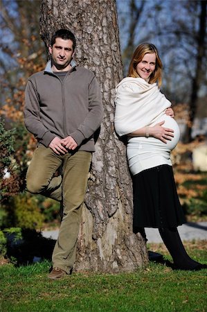 simsearch:400-04659391,k - happy young married family couple outdoor in nature have fun and waiting baby and representing young family growth and pregnancy concept Stock Photo - Budget Royalty-Free & Subscription, Code: 400-05225157