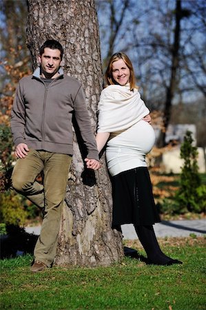 simsearch:400-04659391,k - happy young married family couple outdoor in nature have fun and waiting baby and representing young family growth and pregnancy concept Stock Photo - Budget Royalty-Free & Subscription, Code: 400-05225164