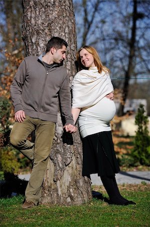 simsearch:400-04659391,k - happy young married family couple outdoor in nature have fun and waiting baby and representing young family growth and pregnancy concept Stock Photo - Budget Royalty-Free & Subscription, Code: 400-05225165