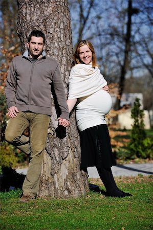 simsearch:400-04659391,k - happy young married family couple outdoor in nature have fun and waiting baby and representing young family growth and pregnancy concept Stock Photo - Budget Royalty-Free & Subscription, Code: 400-05225163