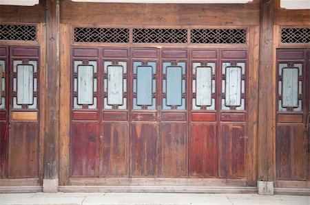 Chinese old wooden door in a ancient building,this style is used in several hundred years ago Stock Photo - Budget Royalty-Free & Subscription, Code: 400-05225194
