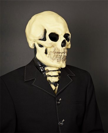 simsearch:400-04275576,k - Portrait of death in a business suit on a dark background Photographie de stock - Aubaine LD & Abonnement, Code: 400-05221560