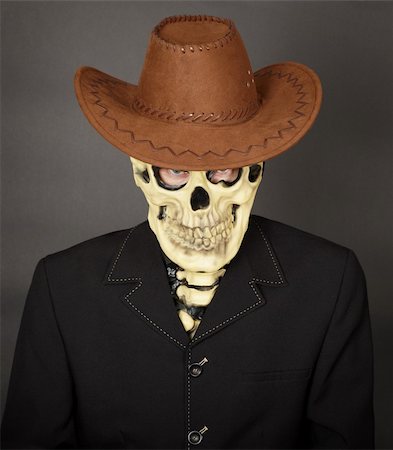 simsearch:400-04275576,k - The man - a skeleton in a leather cowboy hat Photographie de stock - Aubaine LD & Abonnement, Code: 400-05221603