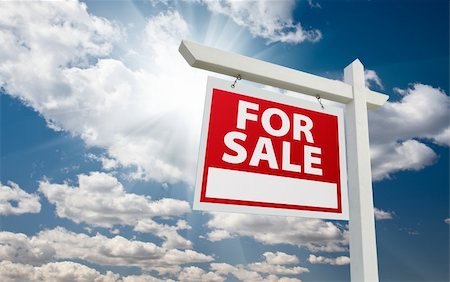 sold sign - For Sale Real Estate Sign over Clouds and Blue Sky with Sun Rays. Photographie de stock - Aubaine LD & Abonnement, Code: 400-05234408