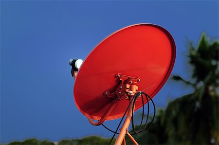 simsearch:400-04843830,k - A red satellite dish against the blue sky background Stock Photo - Budget Royalty-Free & Subscription, Code: 400-05234835