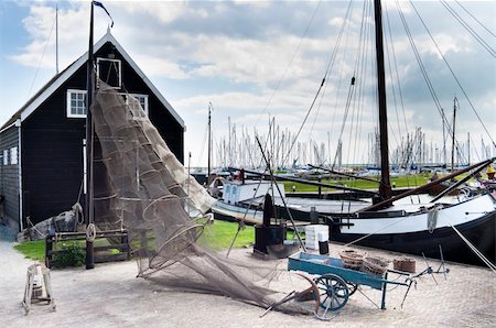 Old Fishing equipment in a dutch harbor Stock Photo - Budget Royalty-Free & Subscription, Code: 400-05236527