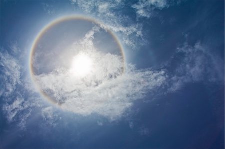 simsearch:400-04265415,k - Sun with circular rainbow, clouds and blue sky Stock Photo - Budget Royalty-Free & Subscription, Code: 400-05238844