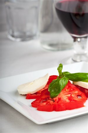 simsearch:700-01099893,k - tomatoes, mozzarella, basil and red wine Stock Photo - Budget Royalty-Free & Subscription, Code: 400-05239413