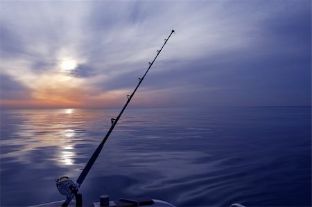 simsearch:400-05896461,k - boat fishing sunrise on sea ocean rod and reels horizon Stock Photo - Budget Royalty-Free & Subscription, Code: 400-05239938