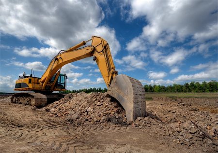 excavator at a construction site Stock Photo - Budget Royalty-Free & Subscription, Code: 400-05230312