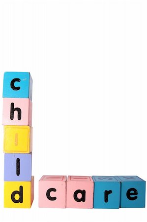 assorted childrens toy letter building blocks against a white background that spell childcare with clipping path Stock Photo - Budget Royalty-Free & Subscription, Code: 400-05246303
