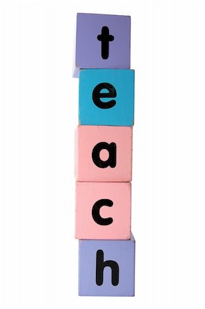 assorted childrens toy letter building blocks against a white background that spell teach with clipping path Stock Photo - Budget Royalty-Free & Subscription, Code: 400-05246312