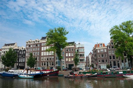 medieval amsterdam houses with their typically facades along a canal Stock Photo - Budget Royalty-Free & Subscription, Code: 400-05247157