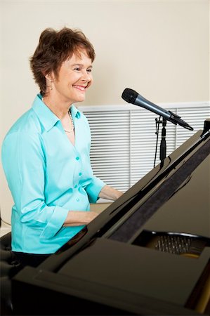 piano playing and singer - Professional musician singing and playing the piano. Stock Photo - Budget Royalty-Free & Subscription, Code: 400-05249527